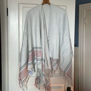 NWOT wrap in ivory with blush and grey stripe detail and fringe.